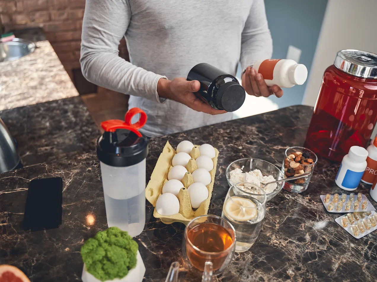 Sportsman With Sports Nutrition At The Table 2021 09 03 15 36 08 Utc