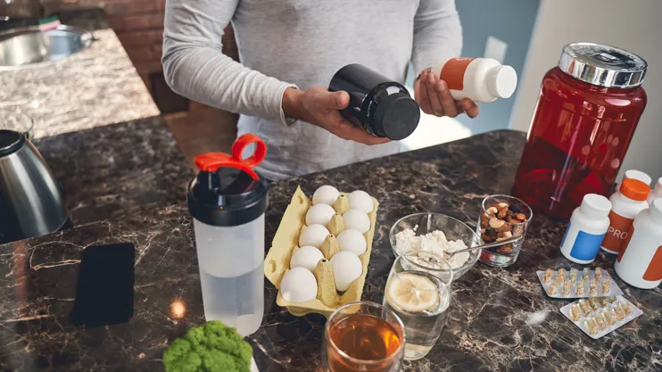 Sportsman With Sports Nutrition At The Table 2021 09 03 15 36 08 Utc